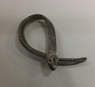 An Antique silver scarf clip in the form of a snak