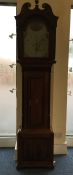 A good oak grandfather clock with arched dial and