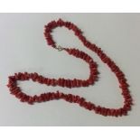 A coral twig necklace with gold clasp. Approx. 30