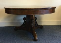 A Victorian mahogany pedestal dining table on thre