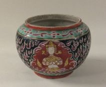 A small Chinese squat pot decorated with figures i