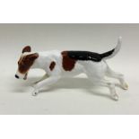 A Royal Doulton figure of a foxhound. Est. £10 - £