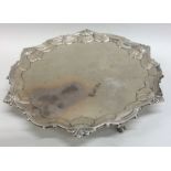 A Georgian silver salver with shell border. London