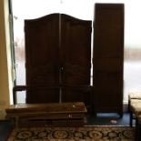 A Continental oak two drawer armoire with shaped t