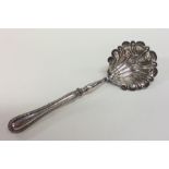 A large Continental silver sifter spoon with bead