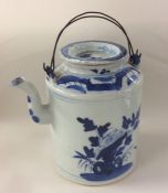 A large Eastern blue and white teapot with double
