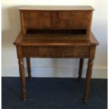 A Continental walnut desk on turned supports. Est.