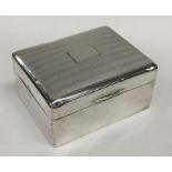 A heavy silver engine turned cigarette box with fi