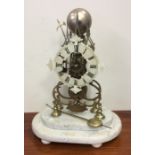 A French brass skeleton clock on oval base. Est. £