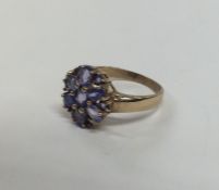 A heavy 9 carat tanzanite cluster ring. Approx. 3.