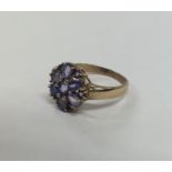 A heavy 9 carat tanzanite cluster ring. Approx. 3.