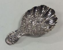 A rare chased silver caddy spoon attractively deco