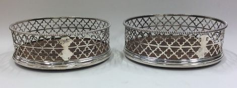 A good pair of Georgian silver wine coasters with