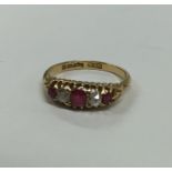 A Victorian 18 carat gold ruby and diamond ring. A