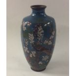 A Chinese cloisonné vase attractively decorated wi