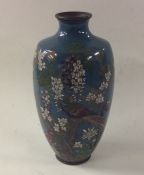 A Chinese cloisonné vase attractively decorated wi