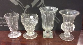 An Antique tapering fluted glass vase on square pe