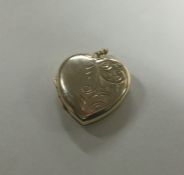 A 9 carat back and front heart shaped locket with