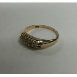A small diamond five stone ring in claw mount. App