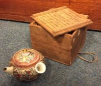 A small Kyoto teapot and cover decorated with figu