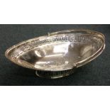 A large pierced George III silver basket on sweepi