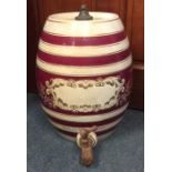 An old porcelain spirit barrel. Est. £30 - £50.