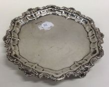 An Edwardian silver waiter with shell border. Shef