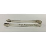 A pair of good quality crisply engraved silver sug