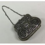 A Russian silver filigree decorated handbag on sus