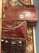 An old crocodile skin handbag etc. Est. £20 - £30.