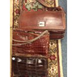 An old crocodile skin handbag etc. Est. £20 - £30.