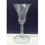 A Georgian tapering wine glass with hollowed stem