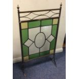 A lead glazed fire screen with stained glass inser