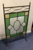 A lead glazed fire screen with stained glass inser