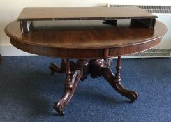 A large mahogany circular loo table to pillar base