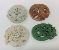 A group of four Chinese hardstone medallions of va