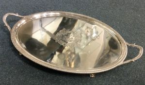 A good large oval Georgian silver tea tray with ga