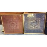 A pair of framed and glazed Oriental silks panels.