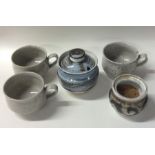 A selection of five pottery cups and pots. Various