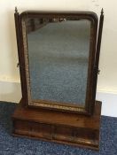 A Georgian mahogany toilet mirror with two drawers