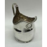 A Georgian silver cream jug of typical form. Londo