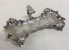 A good Georgian silver chased snuffer tray with le