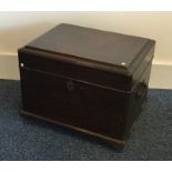 A Georgian oak hinged top trunk with brass handles