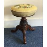 A Victorian tapestry topped stool. Est. £25 - £35.