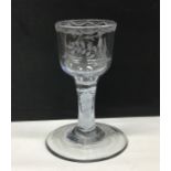 An opaque twist wine glass engraved with flowers a