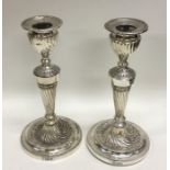 A good pair of beaded circular candlesticks with s