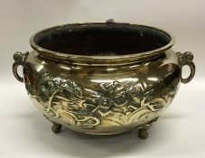 A large Chinese circular brass censer decorated wi