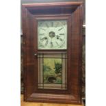 A mahogany mounted wall clock. Est. £20 - £30.