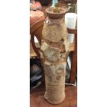 A tall abstract stoneware pottery floor lamp of te