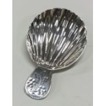 A good Georgian silver caddy spoon with fluted bow